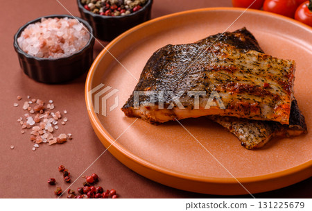 Food, seafood, grilled fish fillet with lemon, salt and spices. Grilled fish fillet Food, seafood, grilled fish fillet with lemon, salt and spices. Grilled fish fillet 131225679