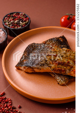 Food, seafood, grilled fish fillet with lemon, salt and spices. Grilled fish fillet Food, seafood, grilled fish fillet with lemon, salt and spices. Grilled fish fillet 131225682