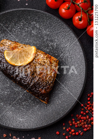 Food, seafood, grilled fish fillet with lemon, salt and spices. Grilled fish fillet 131225700