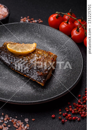 Food, seafood, grilled fish fillet with lemon, salt and spices. Grilled fish fillet Food, seafood, grilled fish fillet with lemon, salt and spices. Grilled fish fillet 131225701