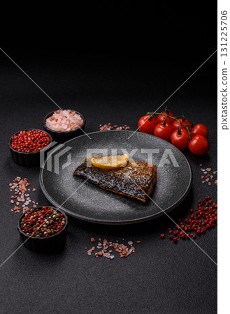 Food, seafood, grilled fish fillet with lemon, salt and spices. Grilled fish fillet Food, seafood, grilled fish fillet with lemon, salt and spices. Grilled fish fillet 131225706