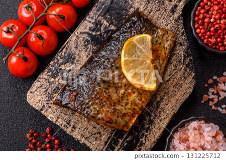 Food, seafood, grilled fish fillet with lemon, salt and spices. Grilled fish fillet Food, seafood, grilled fish fillet with lemon, salt and spices. Grilled fish fillet 131225712