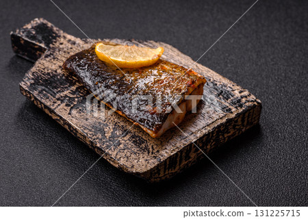 Food, seafood, grilled fish fillet with lemon, salt and spices. Grilled fish fillet Food, seafood, grilled fish fillet with lemon, salt and spices. Grilled fish fillet 131225715