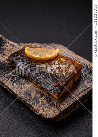 Food, seafood, grilled fish fillet with lemon, salt and spices. Grilled fish fillet Food, seafood, grilled fish fillet with lemon, salt and spices. Grilled fish fillet 131225718