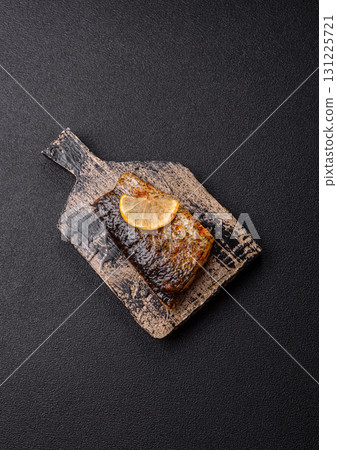 Food, seafood, grilled fish fillet with lemon, salt and spices. Grilled fish fillet 131225721