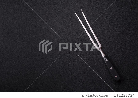 Empty meat or steak fork with vegetables, spices and other ingredients. Meat fork 131225724