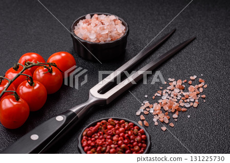 Empty meat or steak fork with vegetables, spices and other ingredients. Meat fork Empty meat or steak fork with vegetables, spices and other ingredients. Meat fork 131225730