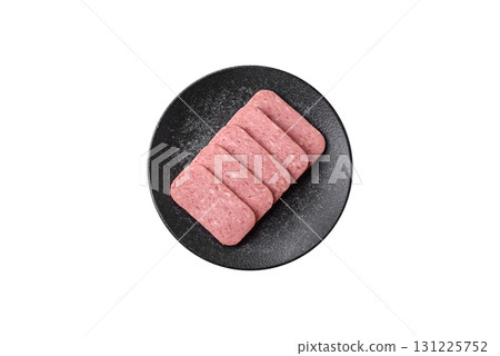 Food, meat, ham sliced in slices for the festive table. Spiced ham 131225752