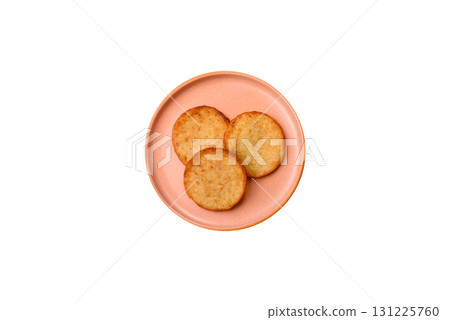 Hash browns, a breakfast food made of potatoes, onions and vegetables. Hash browns with potatoes Hash browns, a breakfast food made of potatoes, onions and vegetables. Hash browns with potatoes 131225760
