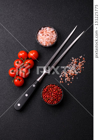 Empty meat or steak fork with vegetables, spices and other ingredients. Meat fork 131225775