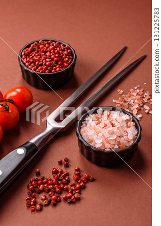Empty meat or steak fork with vegetables, spices and other ingredients. Meat fork Empty meat or steak fork with vegetables, spices and other ingredients. Meat fork 131225783