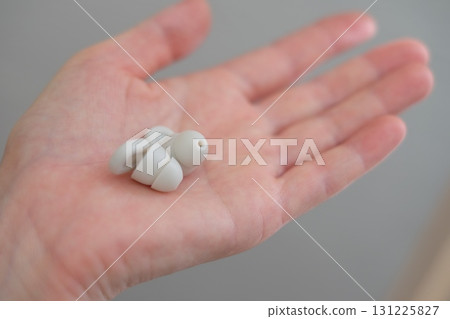 Earplugs in the palm of your hand Earplugs in the palm of your hand 131225827