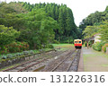 Kiha 200 leaving Tsukizaki Station surrounded by greenery 131226316