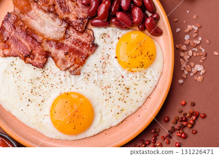 Fried egg, bacon and beans, a classic British breakfast with tomatoes. Egg, bacon and beans 131226471