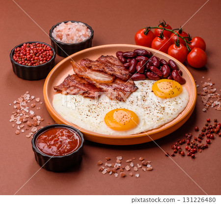 Fried egg, bacon and beans, a classic British breakfast with tomatoes. Egg, bacon and beans 131226480