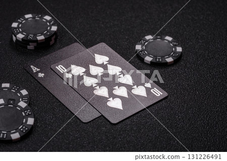 Playing blackjack or baccarat card game in casino with chips, bets and risk. Cards and chips Playing blackjack or baccarat card game in casino with chips, bets and risk. Cards and chips 131226491