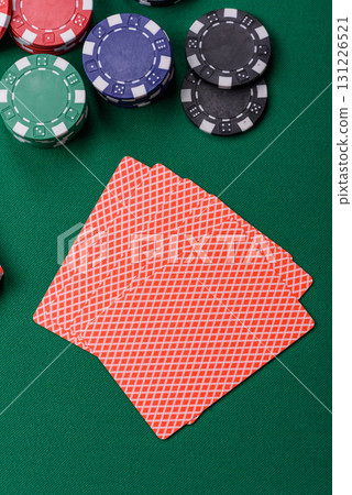 Playing card game poker in casino with chips, bets and risk. Cards and chips on elt Playing card game poker in casino with chips, bets and risk. Cards and chips on elt 131226521