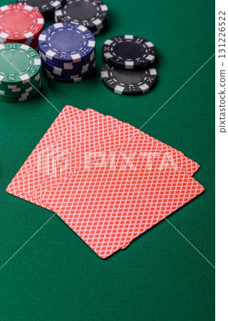 Playing card game poker in casino with chips, bets and risk. Cards and chips on elt 131226522