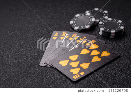 Playing card game poker in casino with chips, bets and risk. Cards and chips on elt 131226708