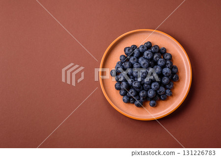 Fresh juicy blueberries, healthy vegan food with vitamins and minerals. Blueberries berry Fresh juicy blueberries, healthy vegan food with vitamins and minerals. Blueberries berry 131226783