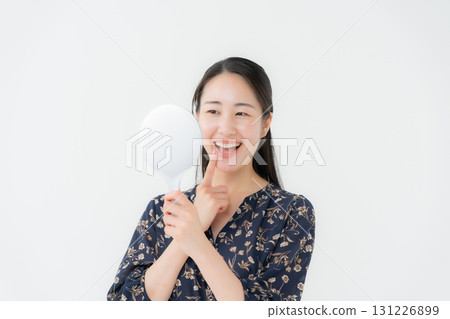Woman looking in the mirror dental 131226899