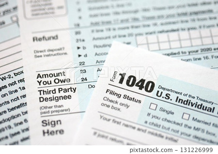 1040 US individual income tax return form blank close up. Few pages of united states tax blank 131226999