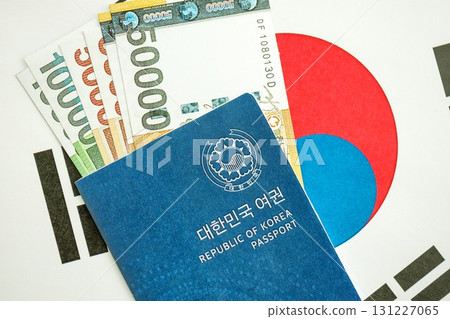 South Korean won money bills in big amount and passport lies on South Korea flag 131227065