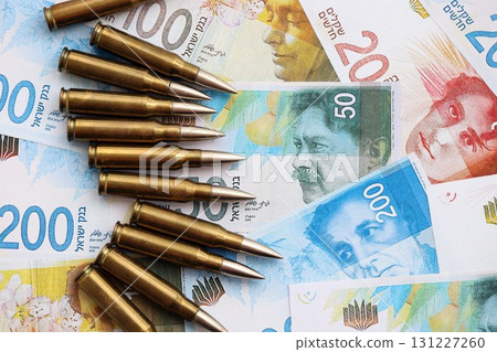 Israel New Shekels banknotes and bullets. The current Israel money bills and ammo 131227260