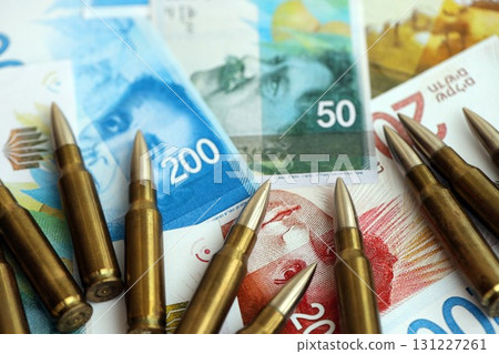 Israel New Shekels banknotes and bullets. The current Israel money bills and ammo 131227261