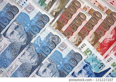 Pakistan rupees banknotes close up. The current Pakistan money bills lies on table in big amount Pakistan rupees banknotes close up. The current Pakistan money bills lies on table in big amount 131227287