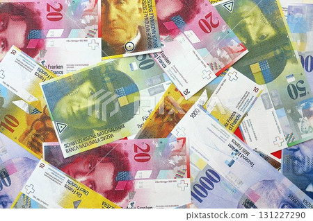 Swiss franc banknotes. The current francs money bills lies on table in big amount Swiss franc banknotes. The current francs money bills lies on table in big amount 131227290