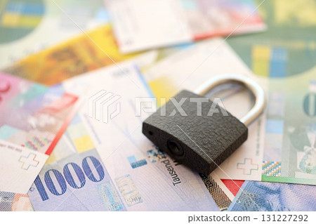 Swiss franc banknotes and padlock. The current francs money bills with lock lies in big amount 131227292