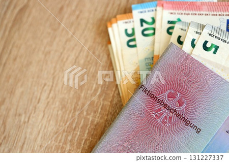 German temporary Permanent resident card specimen and euro money bills. Fiktionsbescheinigung 131227337
