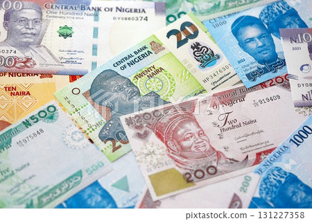 Nigerian naira currency money bills. The current banknotes lies on table in big amount Nigerian naira currency money bills. The current banknotes lies on table in big amount 131227358