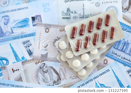 United Arab Emirates dirham currency money bills and medicine pills. The concept of medicine and pharmacy United Arab Emirates dirham currency money bills and medicine pills. The concept of medicine and pharmacy 131227395