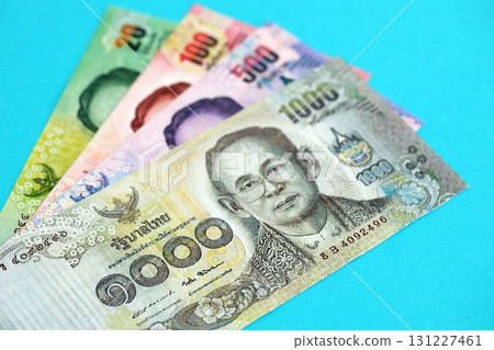 Thai baht money bills in big amount on blue. Finance and banking concept 131227461