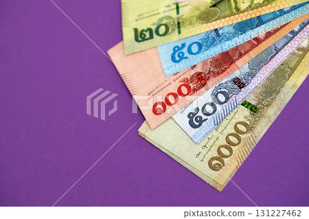 Thai baht money bills in big amount on purple. Finance and banking concept 131227462