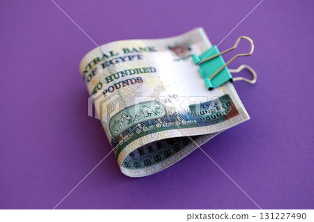 Egyptian pound money bills in big amount on purple. Finance and banking concept 131227490