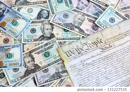National Debt Ceiling Concept - US Constitution with different banknotes of Dollar Bills National Debt Ceiling Concept - US Constitution with different banknotes of Dollar Bills 131227535
