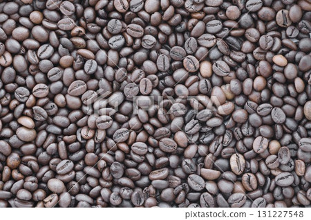 Coffee bean background in detail. Very big amount of brown coffee beans Coffee bean background in detail. Very big amount of brown coffee beans 131227548