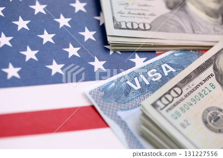 Work and Travel VISA, Immigration with Dollars banknotes on US flag 131227556