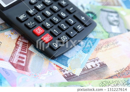 Bahraini dinar currency money bills and calculator. The concept of taxation and money count 131227614