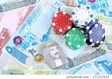 Bahraini dinar currency money bills and bunch of casino chips. The concept of gambling and casino 131227625