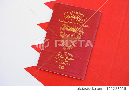 Bahraini passport on flag. The concept of citizenship Bahraini passport on flag. The concept of citizenship 131227626