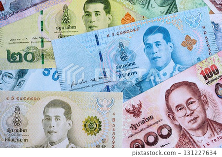 Thai baht currency money bills. The current banknotes lies on table in big amount Thai baht currency money bills. The current banknotes lies on table in big amount 131227634