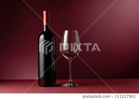Red wine on a dark red background. 131227901
