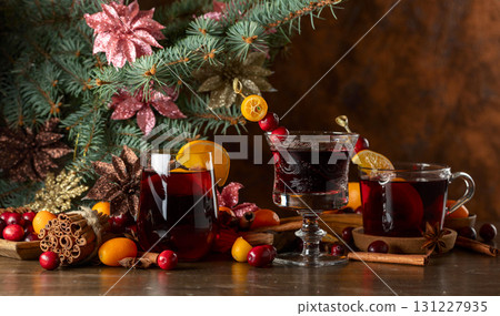 Christmas drinks with ingredients on a background of Christmas tree. 131227935