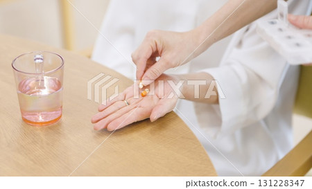 Elderly Asian people receiving medicine 131228347