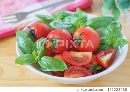 Mini tomatoes and basil 131228486