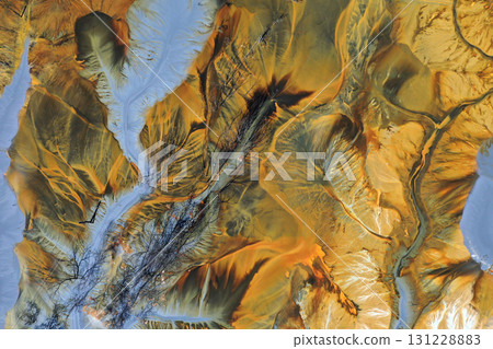 Aerial view of surreal natural patterns of gold cyanide leaching flowing into decanting lake 131228883